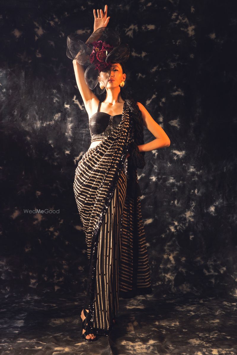 Printed pant saree with leather blouse by Qbik